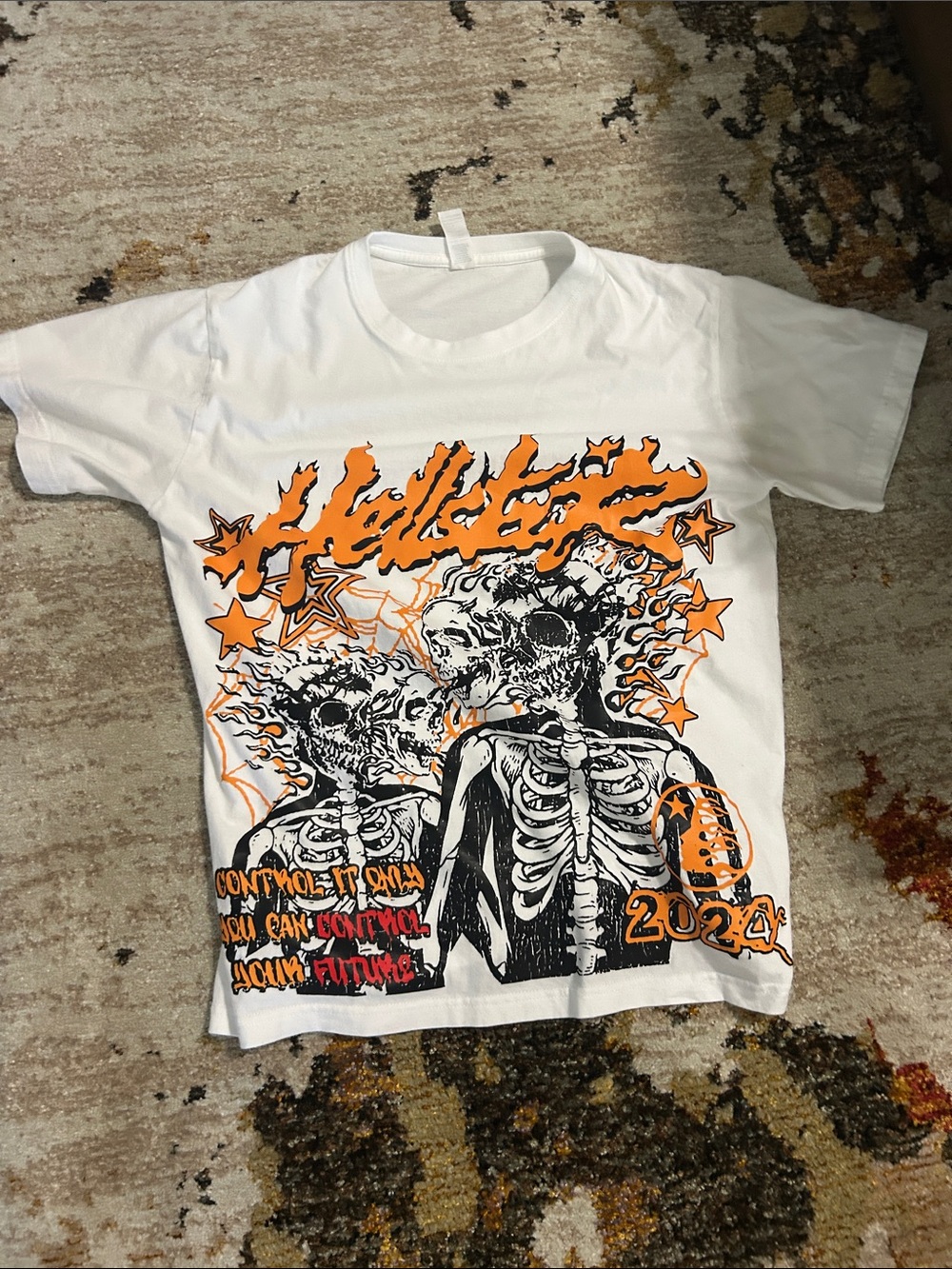 H&M White Short Sleeve Tee with Black Skeleton Graphic and Orange Accents